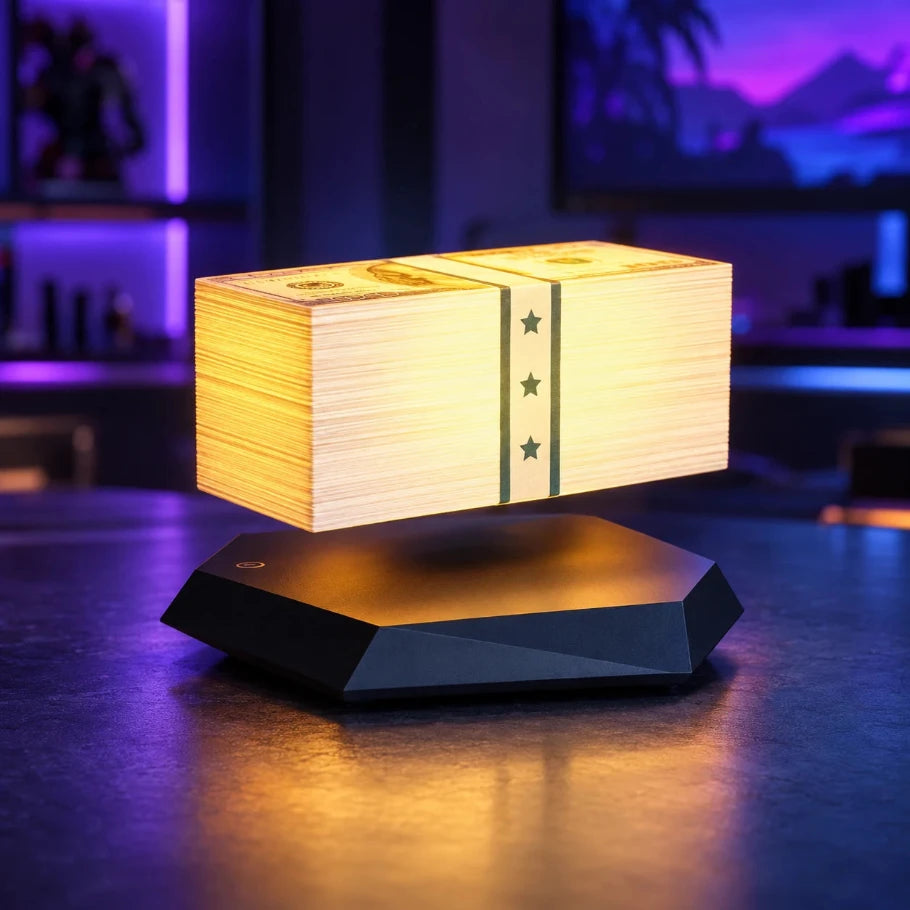 Floating money stack lamp on a square black base in a cinematic studio setup