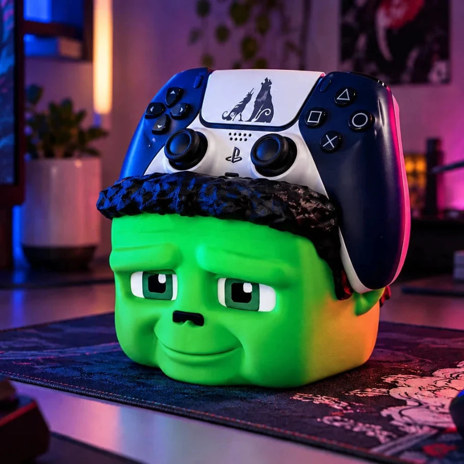 green frankenstein controller holder with a ps5 controller on a neon-lit gaming desk - fictioo