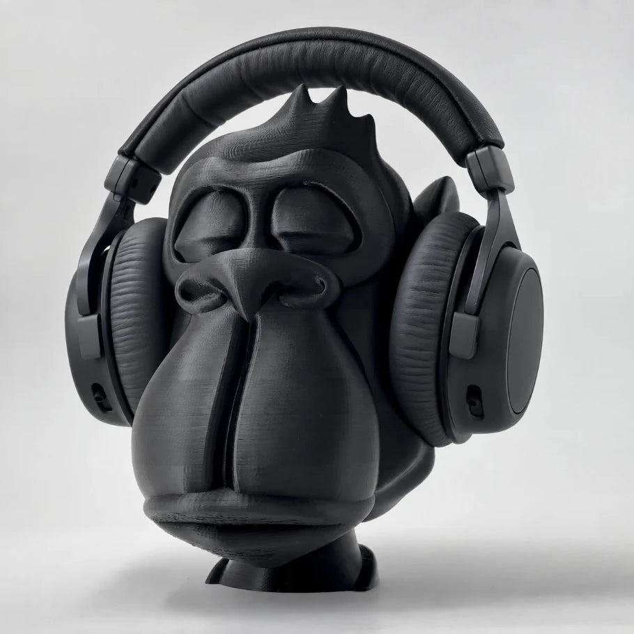 matte-black zen gorilla headphone stand holding black over-ear headphones, three-quarter front view