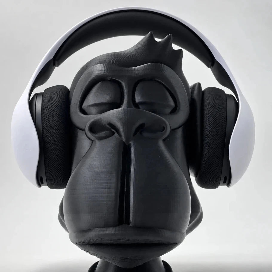 Zen Gorilla headphone stand, front view, displaying white over-ear wireless gaming headphones